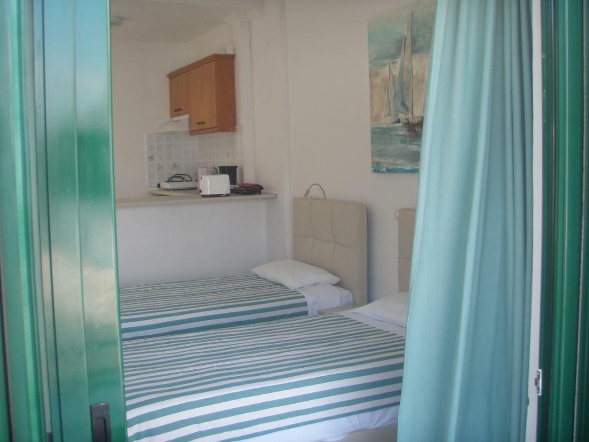 Umbrella Beach Apartments Kávos Dış mekan fotoğraf